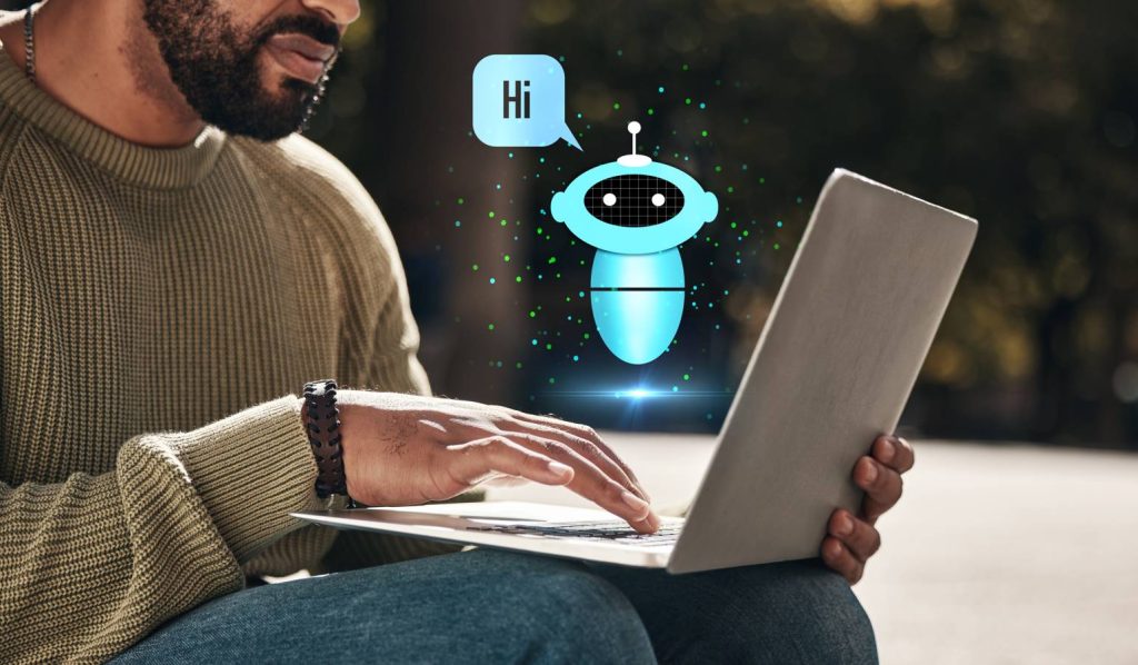 Man using laptop with chatbot assistant